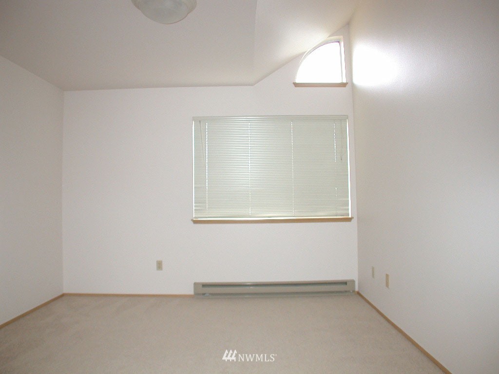 2900 Northeast 8th Street Renton, WA 98056 - Photo 7 of 25 an empty room with a window
