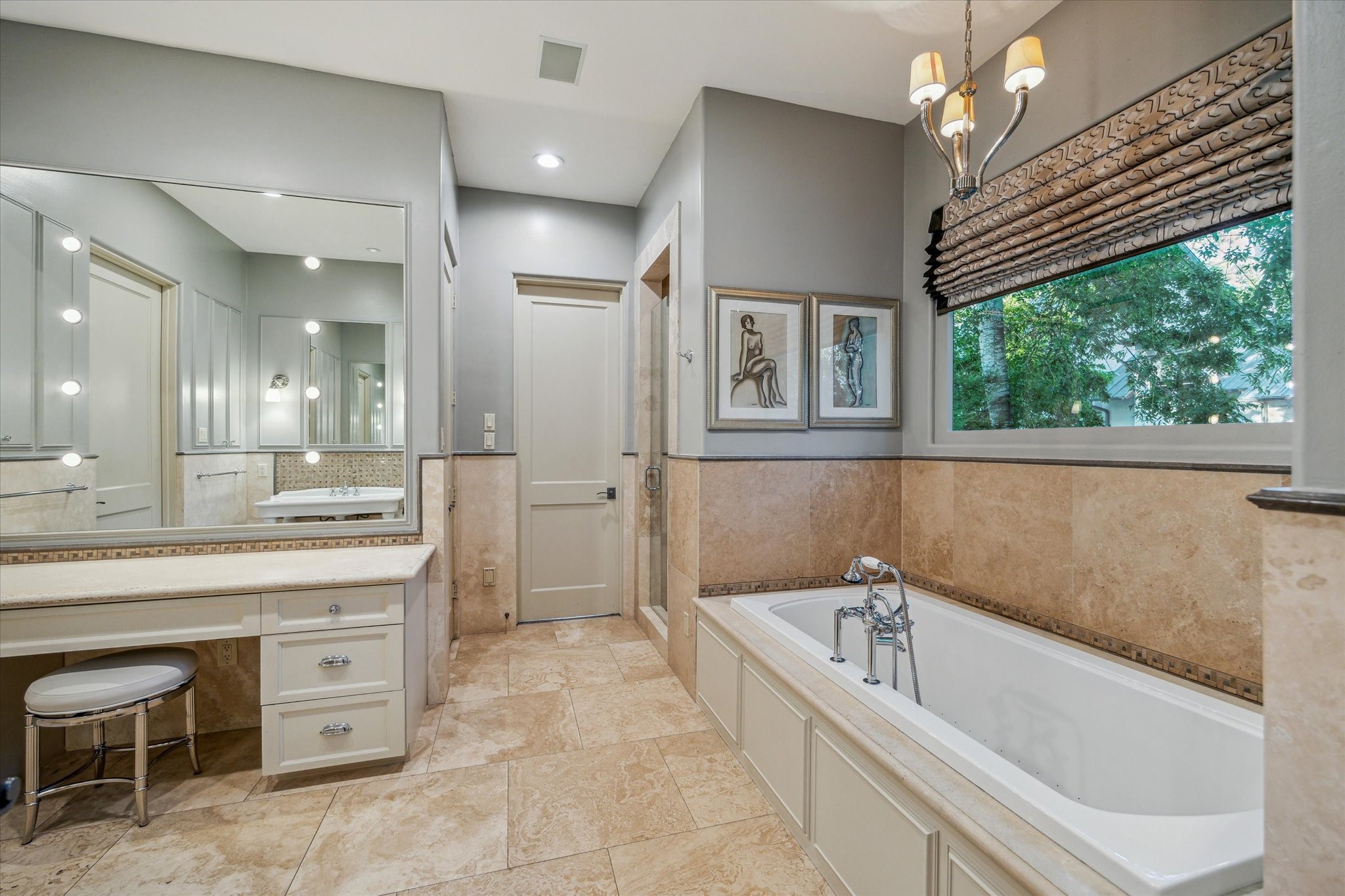 354 Piney Point Road Houston, TX 77024 - Photo 29 of 49 a spacious bathroom with a bathtub and a sink