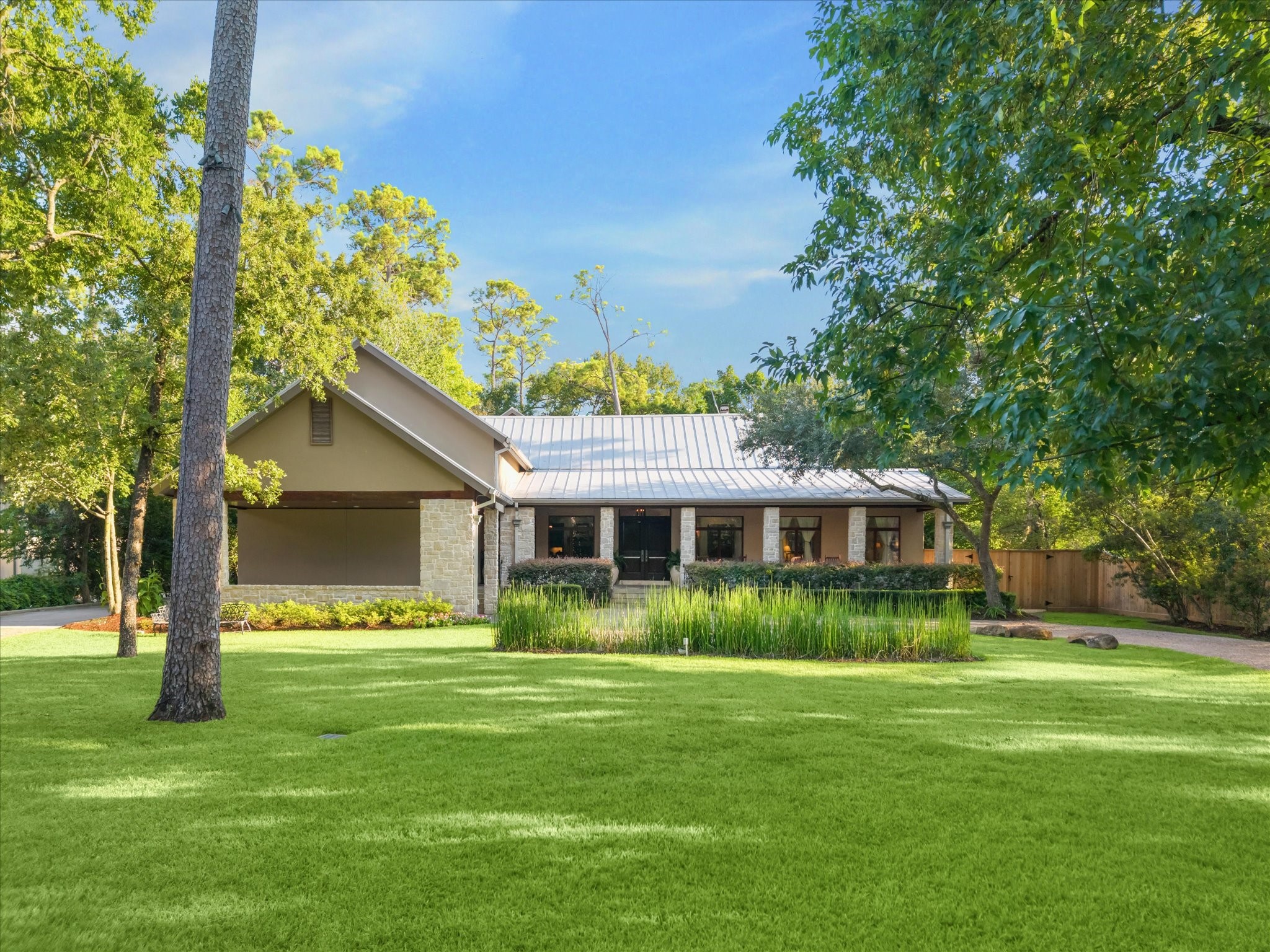 354 Piney Point Road Houston, TX 77024 - Photo 46 of 49 a front view of house with yard and green space