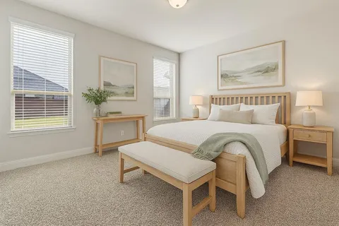 a bedroom with a bed and a table