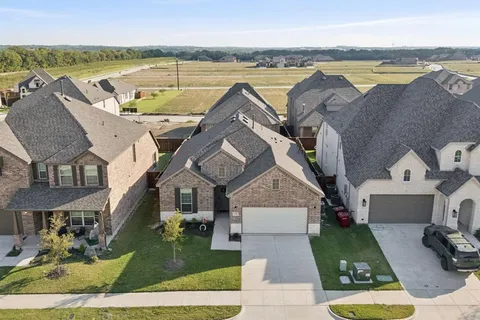 an aerial view of a house with a garden
