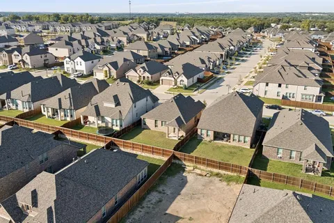 an aerial view of a house with swimming pool