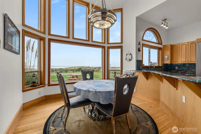 a view of a dining room with furniture window and wooden floor