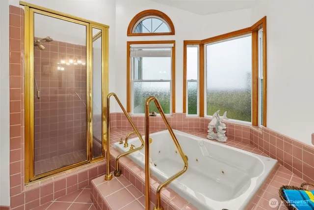 a view of a bathroom with mirror and windows