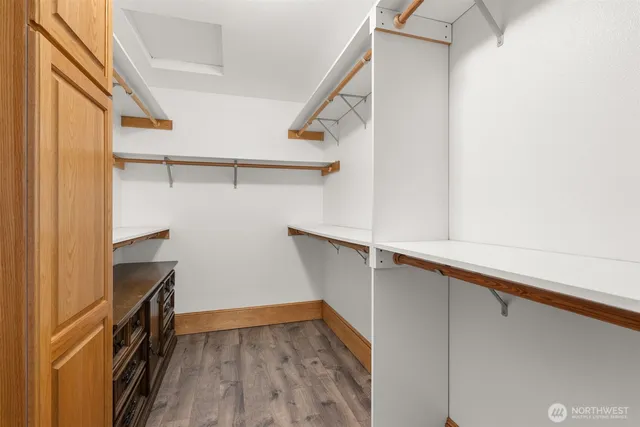 a view of a room with wooden floor and staircase