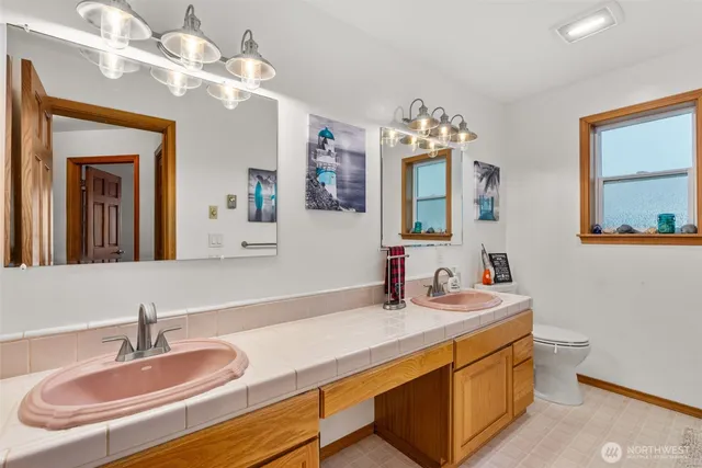 a bathroom with a sink double vanity and a mirror
