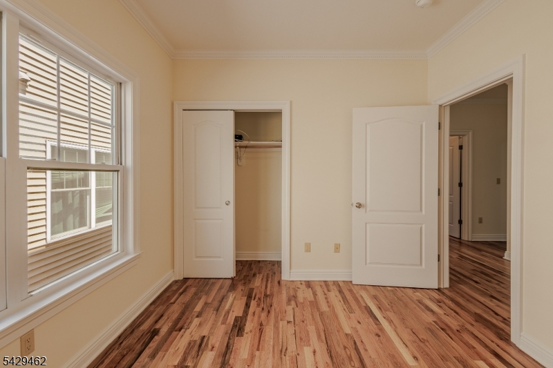 29 Freeman Street, Unit D2 Newark, NJ 07105 - Photo 13 of 29 a view of a livingroom with wooden floor and window