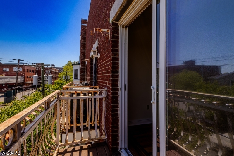 29 Freeman Street, Unit D2 Newark, NJ 07105 - Photo 26 of 29 a view of balcony with two chairs and a swing