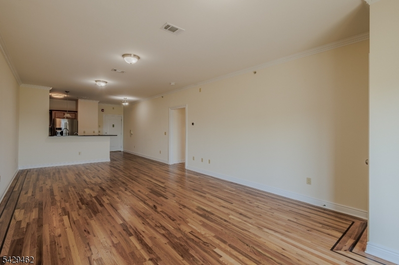 29 Freeman Street, Unit D2 Newark, NJ 07105 - Photo 6 of 29 a view of a room with wooden floor and a sink