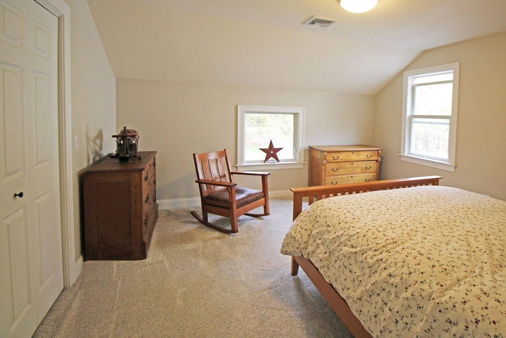 263 Sylvester Road Northampton, MA 01062 - Photo 27 of 35 a bedroom with a bed and chair
