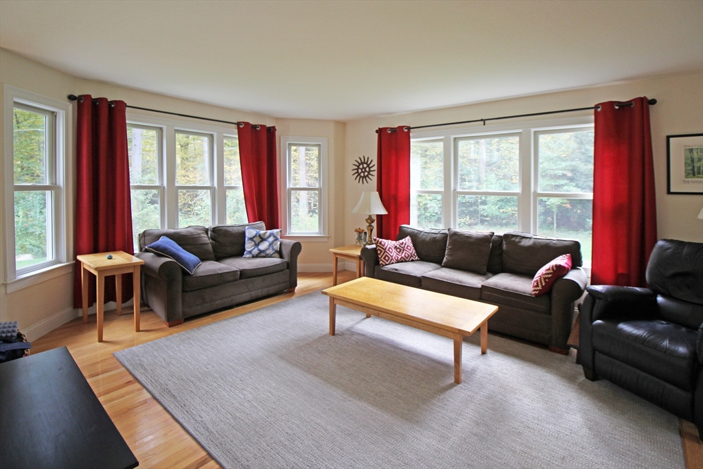 263 Sylvester Road Northampton, MA 01062 - Photo 10 of 35 a living room with furniture and a large window