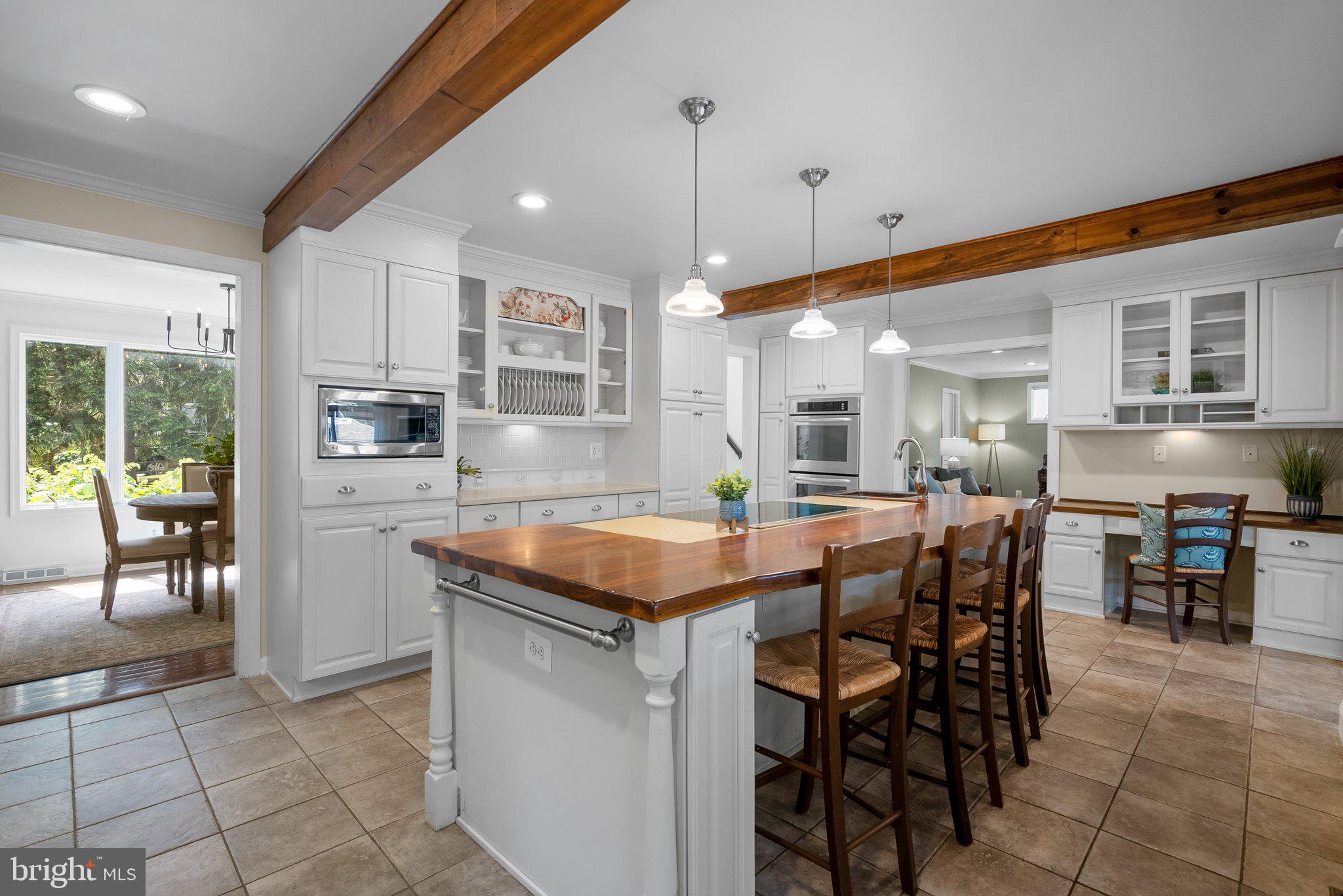 743 Rolling View Drive Annapolis, MD 21409 - Photo 19 of 100 a kitchen with stainless steel appliances granite countertop a table chairs sink and cabinets