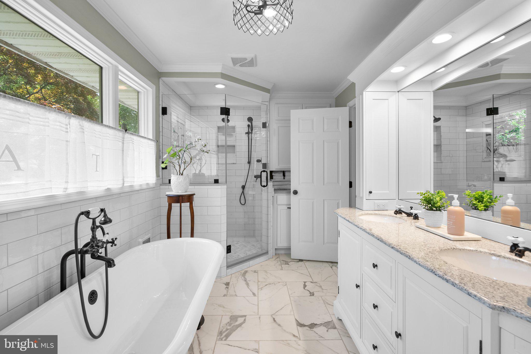 743 Rolling View Drive Annapolis, MD 21409 - Photo 46 of 100 a bathroom with a granite countertop sink a mirror and shower