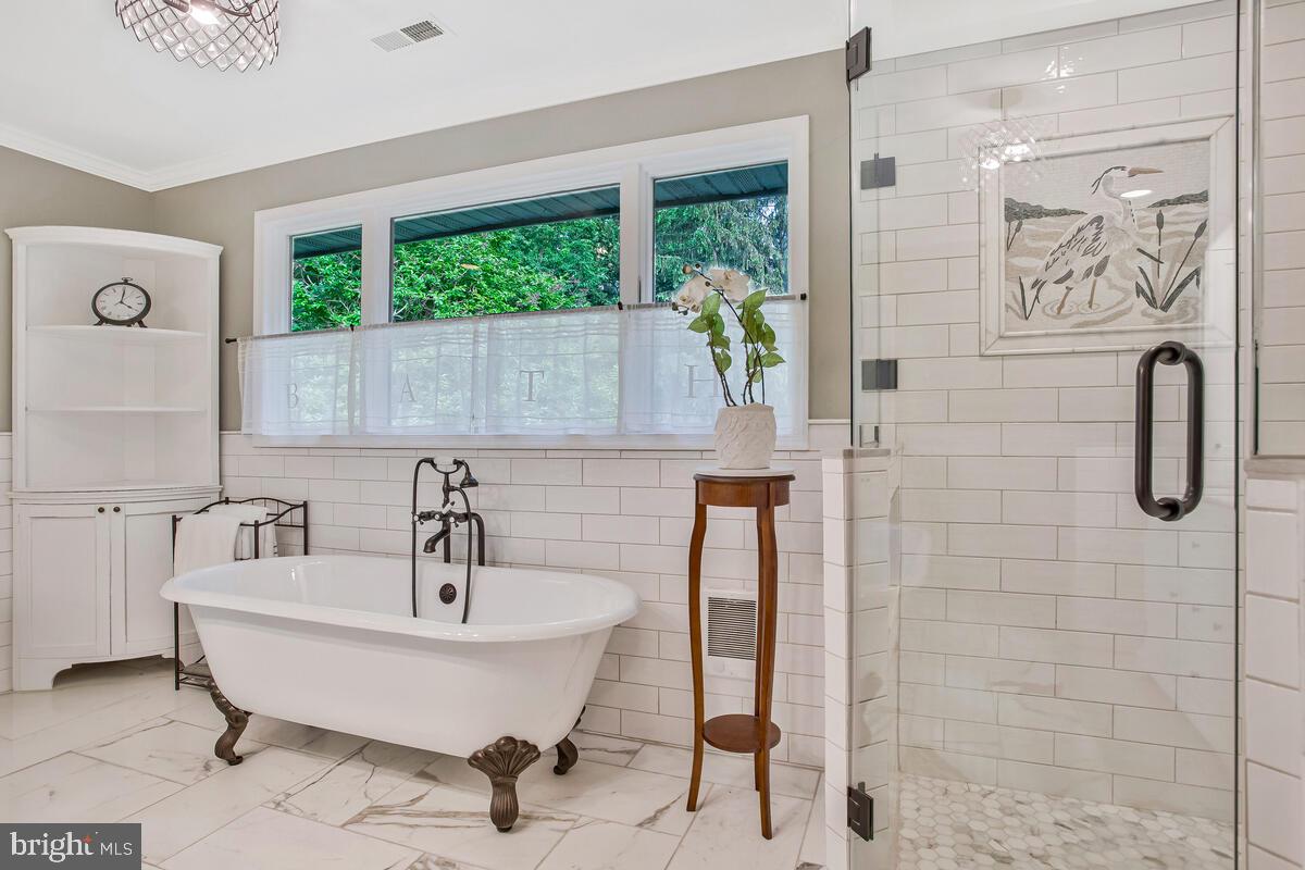 743 Rolling View Drive Annapolis, MD 21409 - Photo 48 of 100 a bathroom with a sink and a mirror