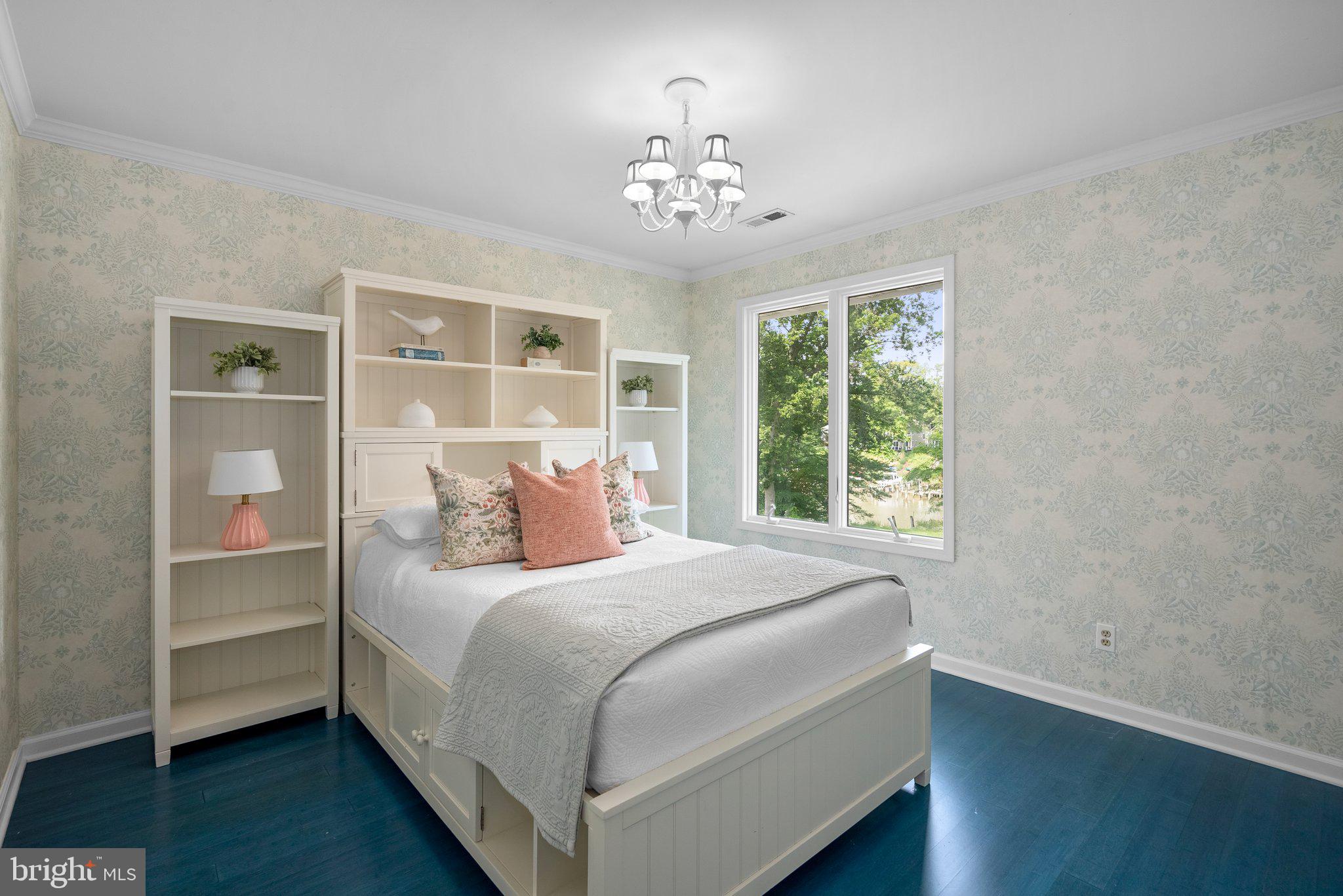 743 Rolling View Drive Annapolis, MD 21409 - Photo 51 of 100 a bedroom with a large bed and a chandelier