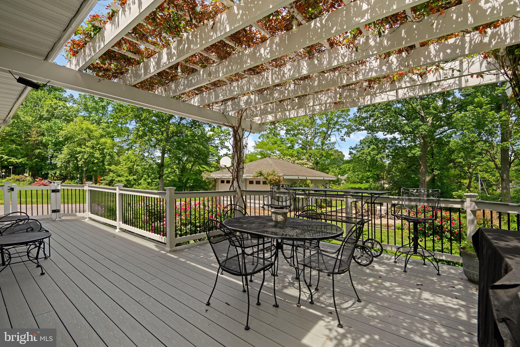 743 Rolling View Drive Annapolis, MD 21409 - Photo 62 of 100 a view of a chairs and table on the wooden deck