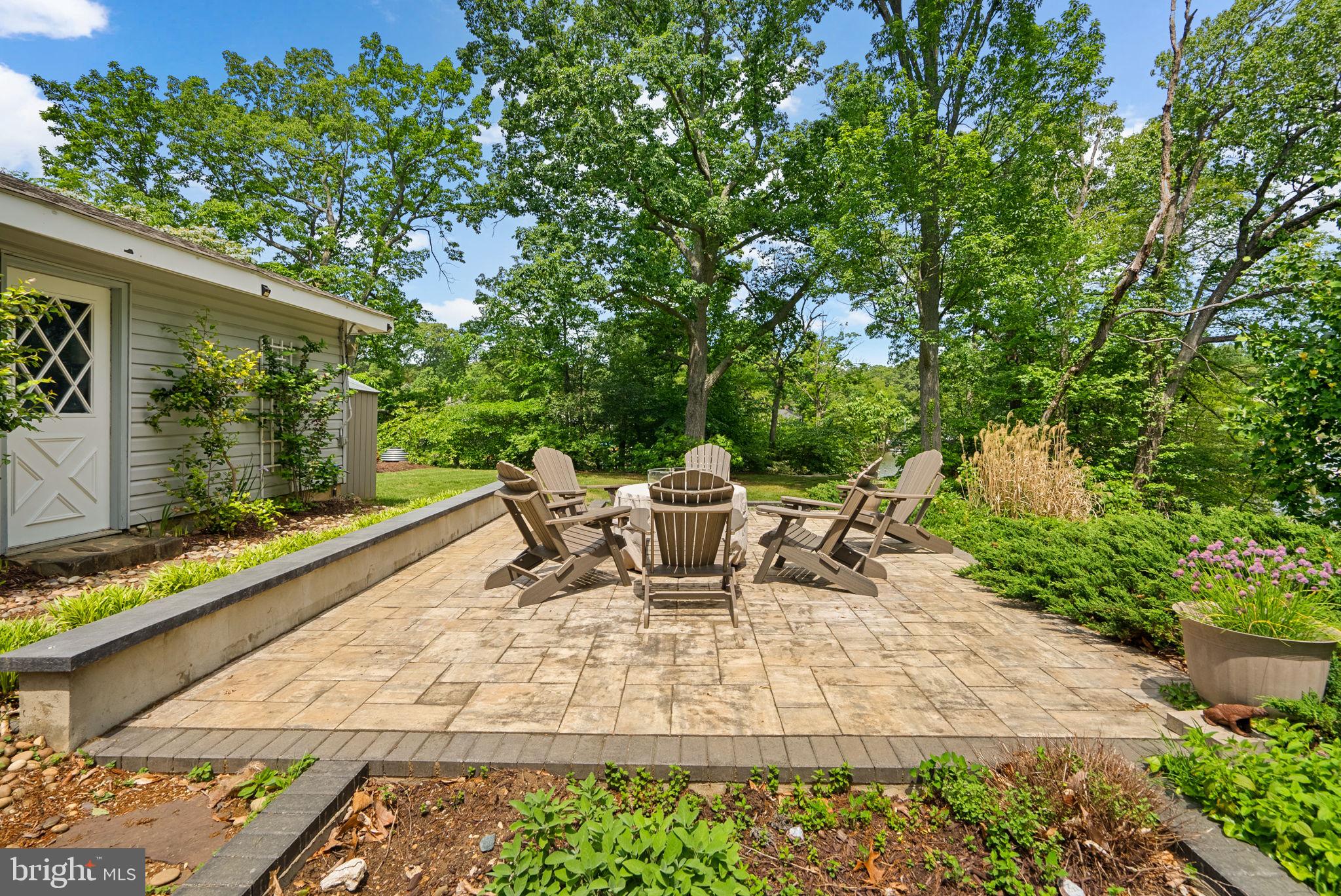 743 Rolling View Drive Annapolis, MD 21409 - Photo 63 of 100 a view of a patio with table and chairs and potted plants