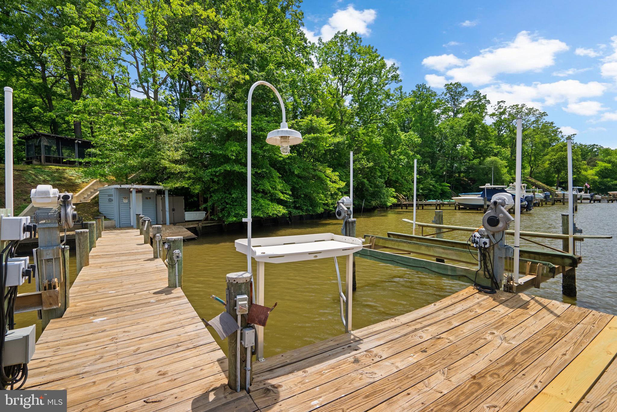 743 Rolling View Drive Annapolis, MD 21409 - Photo 75 of 100 a view of a wooden deck with chairs