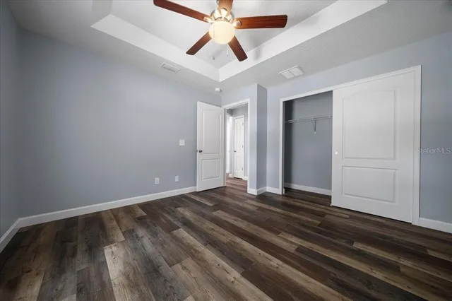 a view of storage and utility room with wooden floor