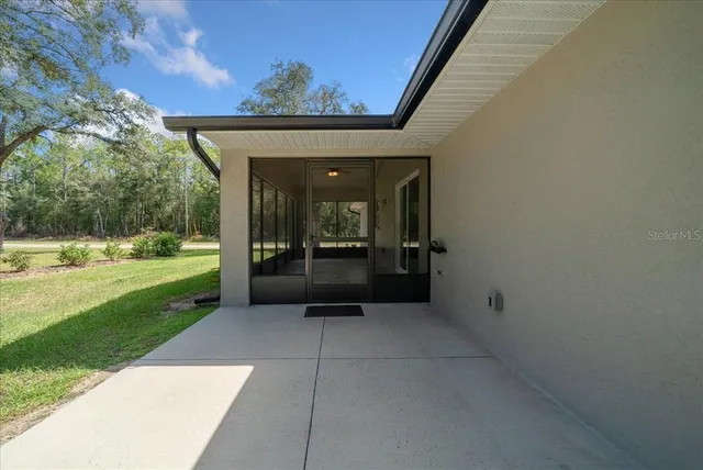a view of a house with a yard and garage