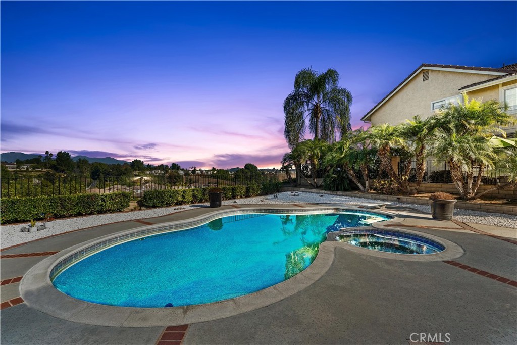 a view of a swimming pool with a yard
