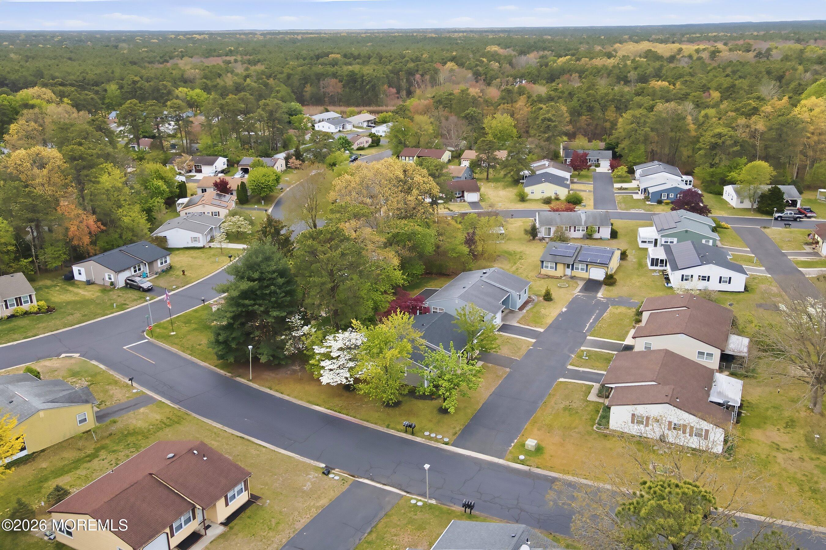 2 Berry Hill Road, Unit 72 Whiting, NJ 08759 - Photo 22 of 43 an aerial view of residential houses with outdoor space