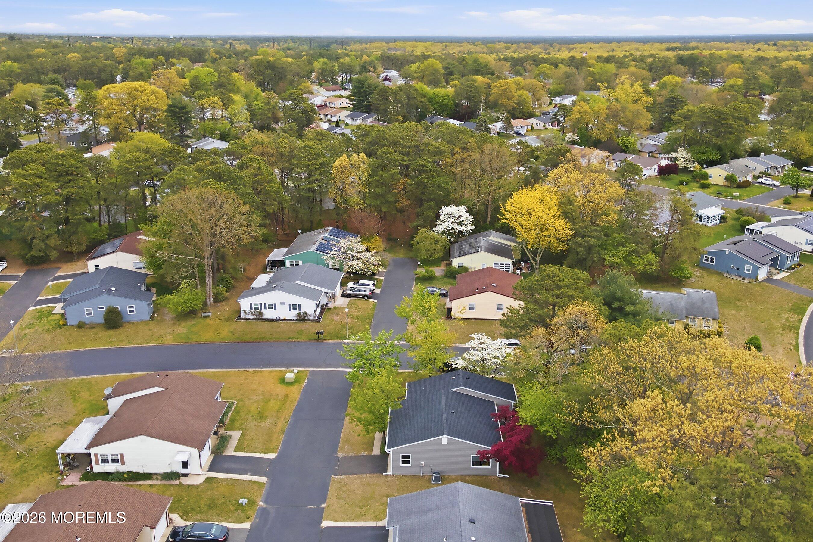 2 Berry Hill Road, Unit 72 Whiting, NJ 08759 - Photo 24 of 43 an aerial view of residential houses with outdoor space