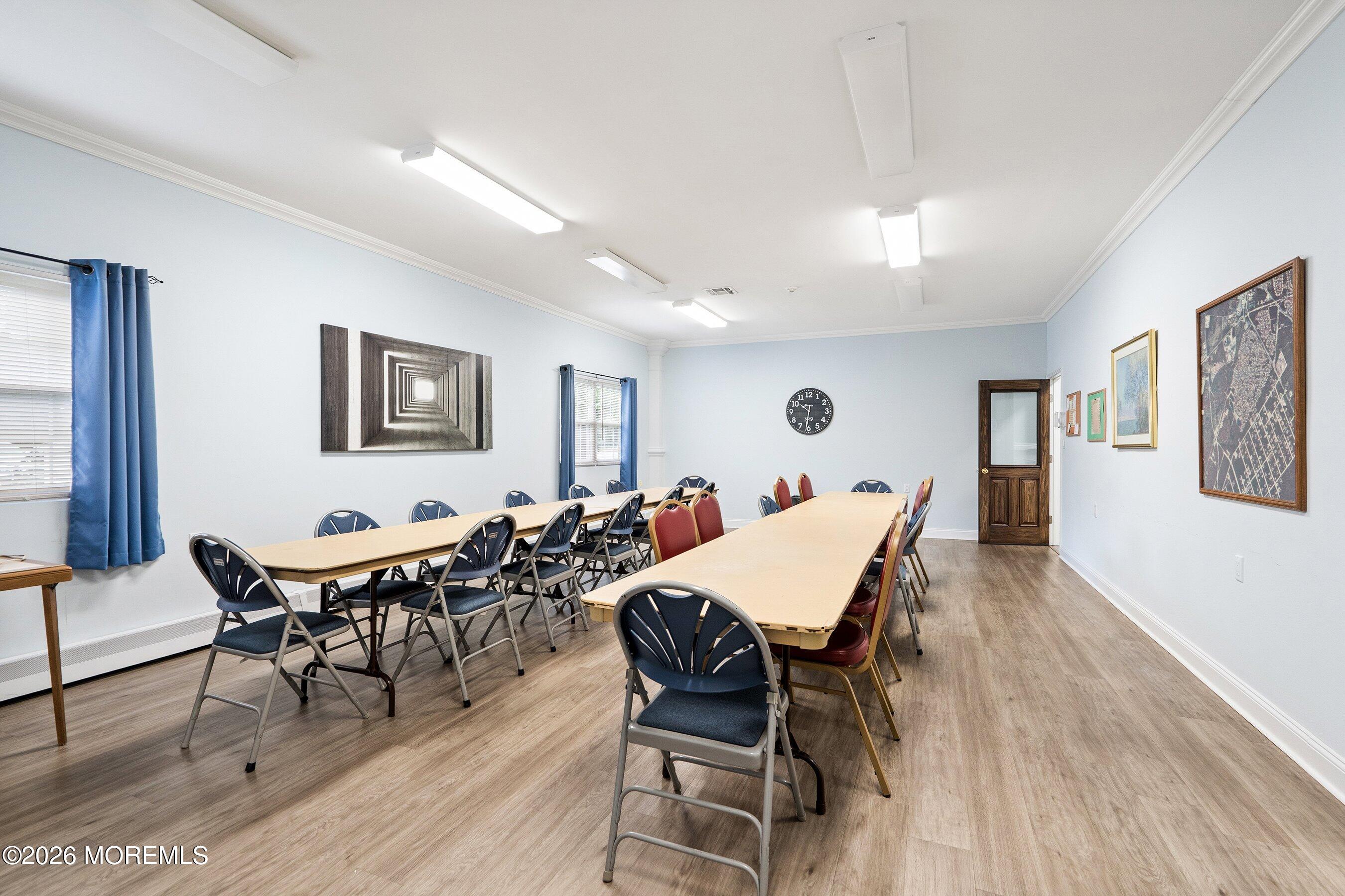 2 Berry Hill Road, Unit 72 Whiting, NJ 08759 - Photo 32 of 43 a dining room with furniture and wooden floor
