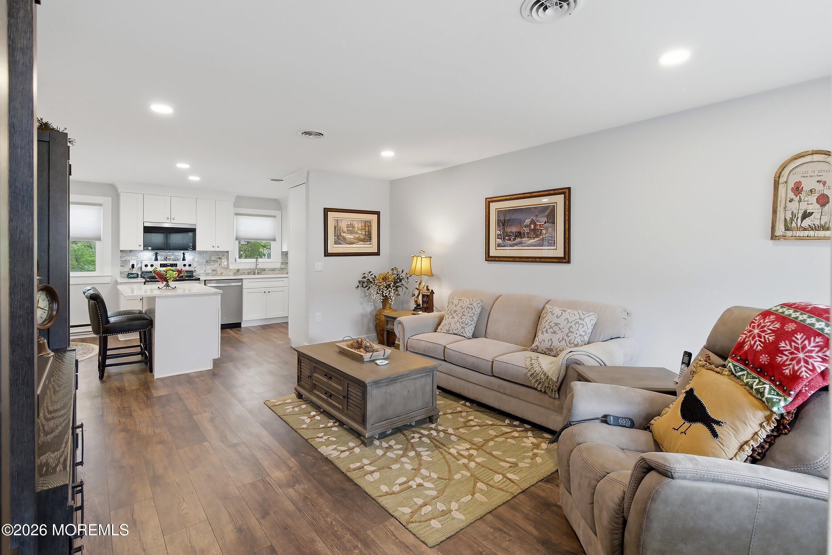 2 Berry Hill Road, Unit 72 Whiting, NJ 08759 - Photo 7 of 43 a living room with furniture and kitchen view
