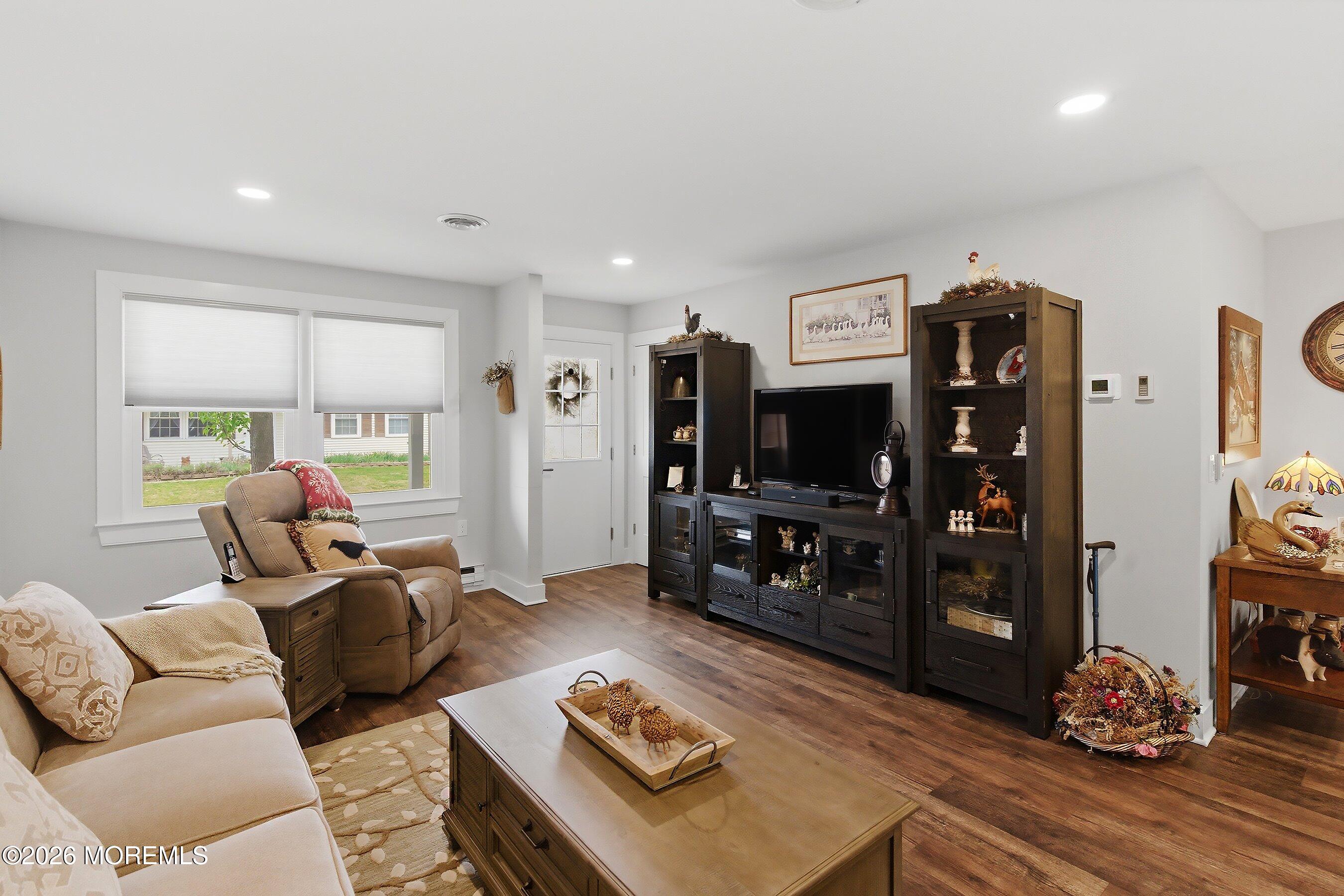2 Berry Hill Road, Unit 72 Whiting, NJ 08759 - Photo 8 of 43 a living room with furniture and a flat screen tv