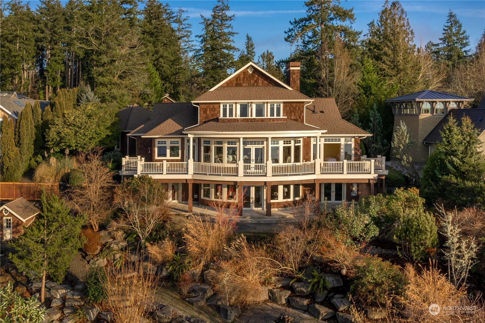 a front view of a house with a yard and balcony