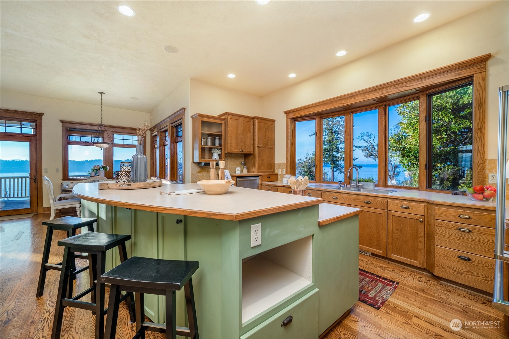 4141 Boston Harbor Road Northeast Olympia, WA 98506 - Photo 19 of 40 a kitchen with a stove a sink and a refrigerator