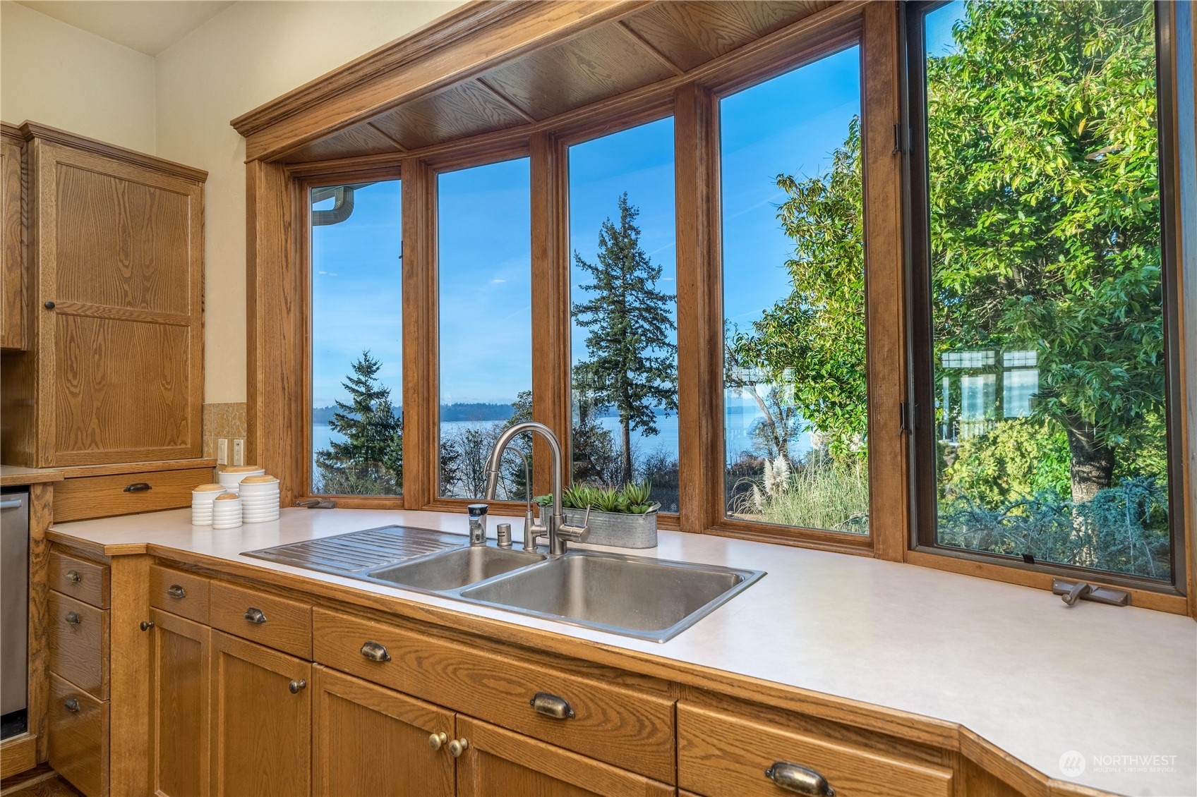 4141 Boston Harbor Road Northeast Olympia, WA 98506 - Photo 20 of 40 a sink with a large window and cabinets
