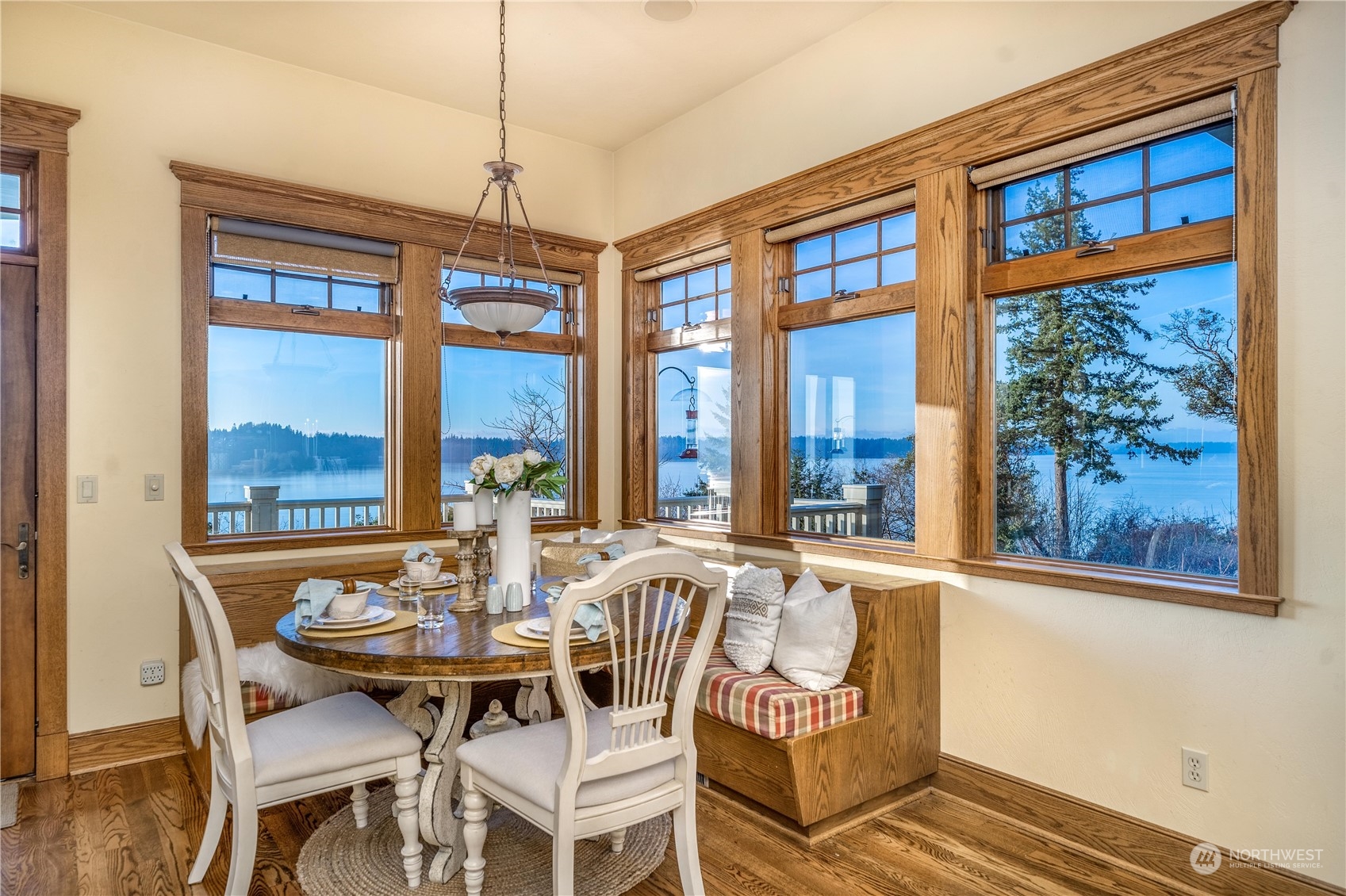4141 Boston Harbor Road Northeast Olympia, WA 98506 - Photo 22 of 40 a view of a dining room with furniture large windows and wooden floor