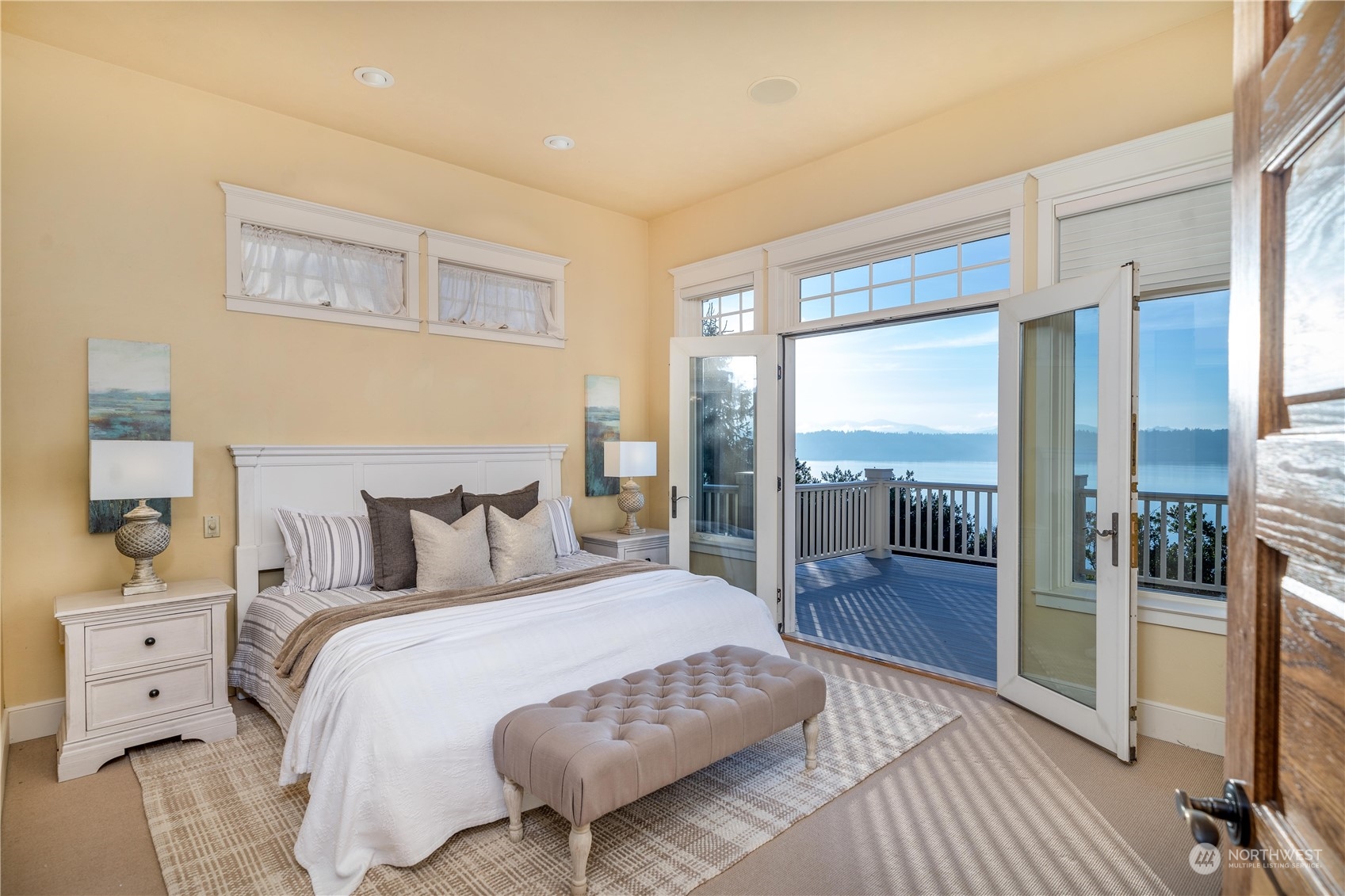 4141 Boston Harbor Road Northeast Olympia, WA 98506 - Photo 25 of 40 a bedroom with a bed and a large window