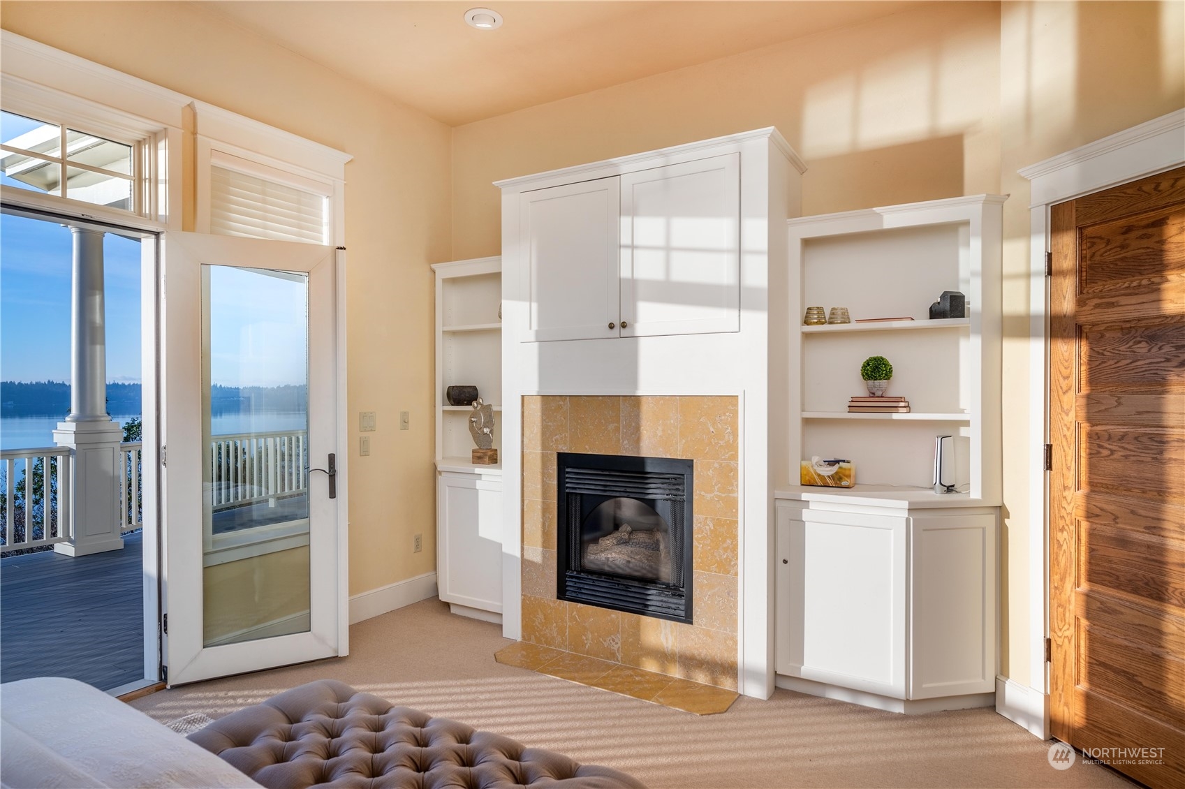 4141 Boston Harbor Road Northeast Olympia, WA 98506 - Photo 27 of 40 a living room with a fireplace and wooden floor