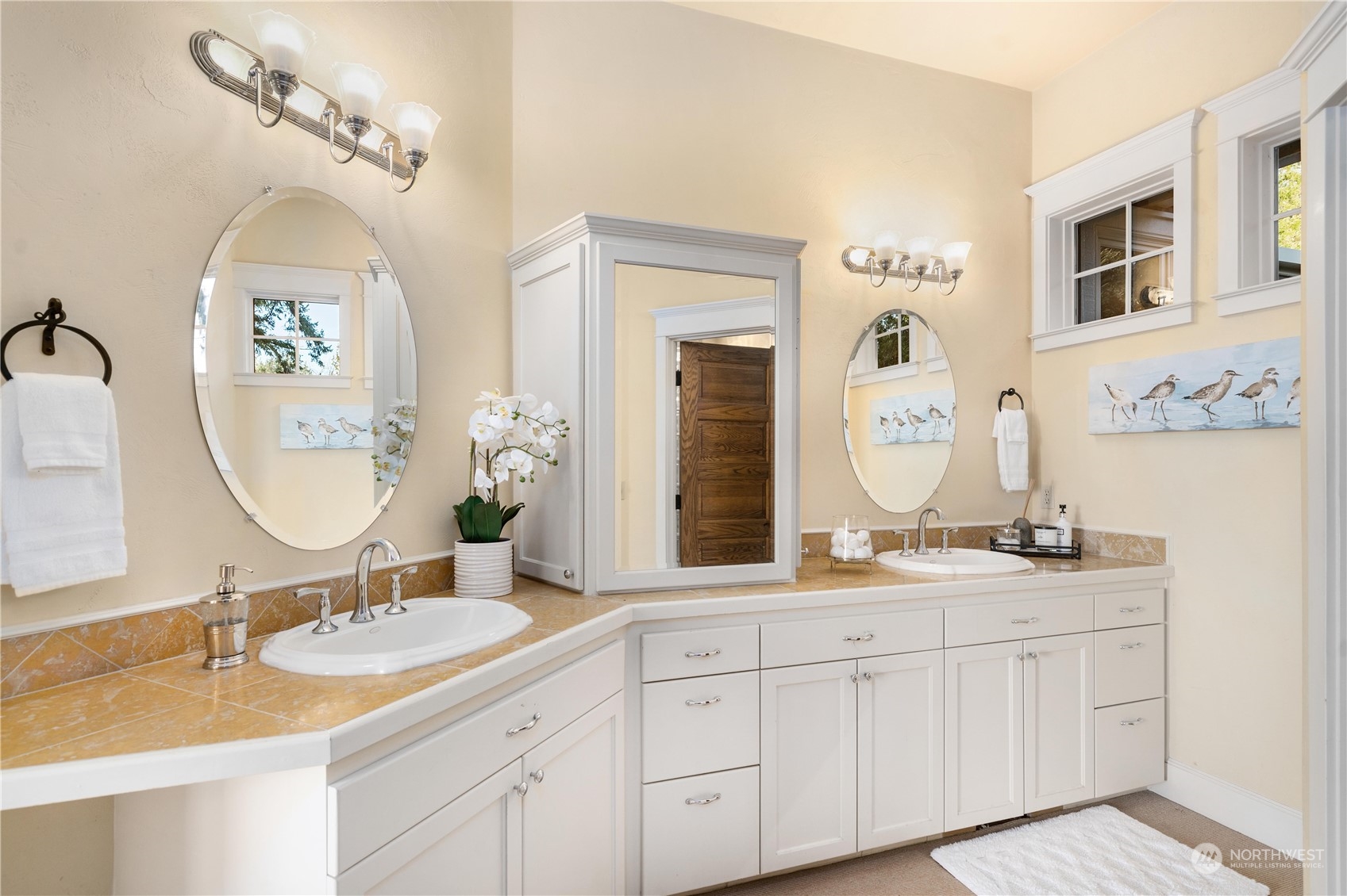 4141 Boston Harbor Road Northeast Olympia, WA 98506 - Photo 29 of 40 a bathroom with a double vanity sink and a mirror