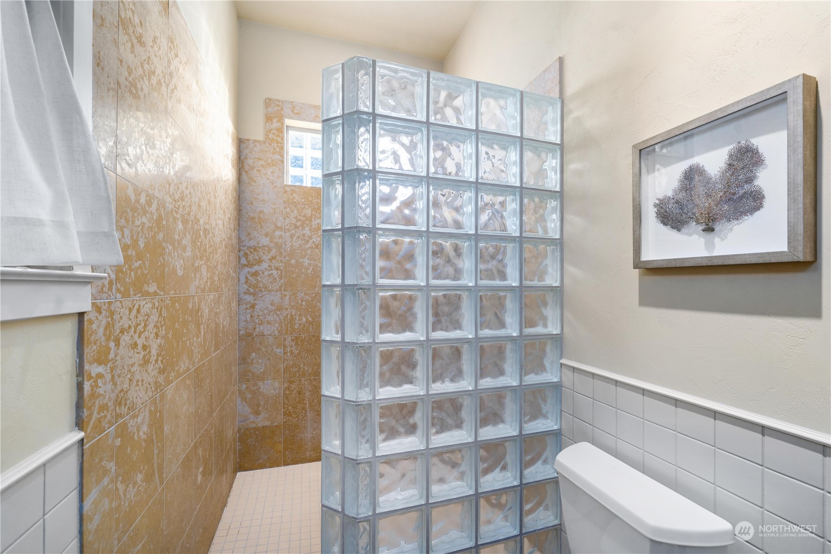 4141 Boston Harbor Road Northeast Olympia, WA 98506 - Photo 30 of 40 a bathroom with a toilet and a shower curtain