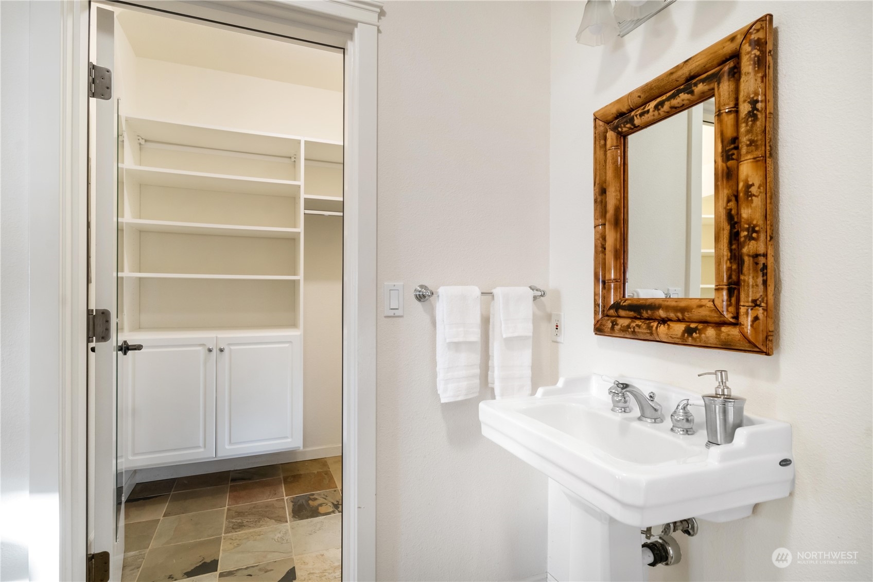 4141 Boston Harbor Road Northeast Olympia, WA 98506 - Photo 32 of 40 a bathroom with a sink a mirror and shower