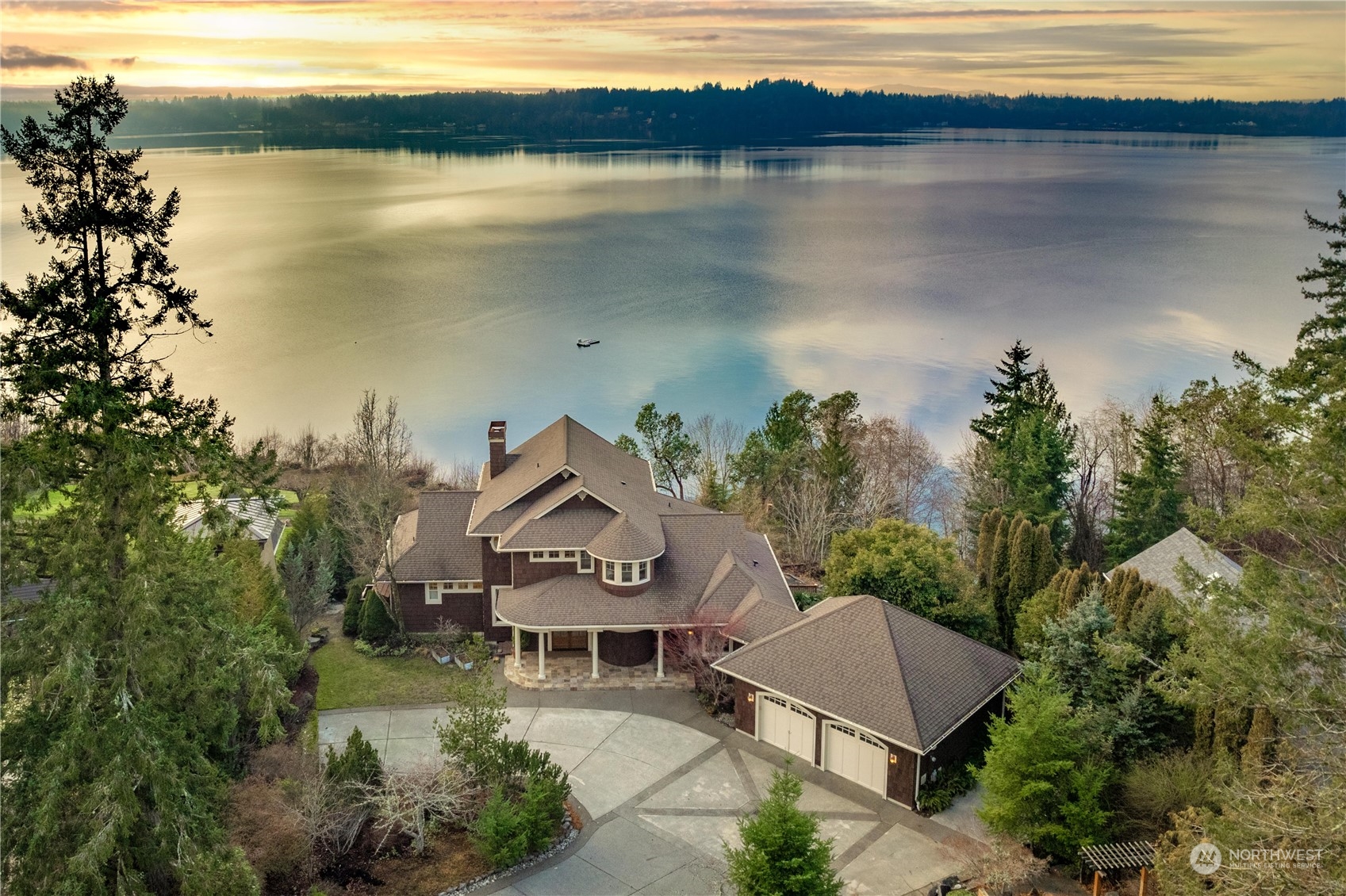 4141 Boston Harbor Road Northeast Olympia, WA 98506 - Photo 39 of 40 a view of a lake with a house in the background