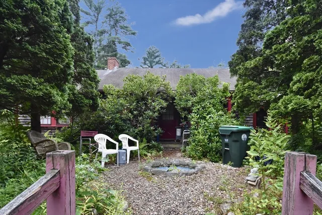 a view of a chairs and table in the garden