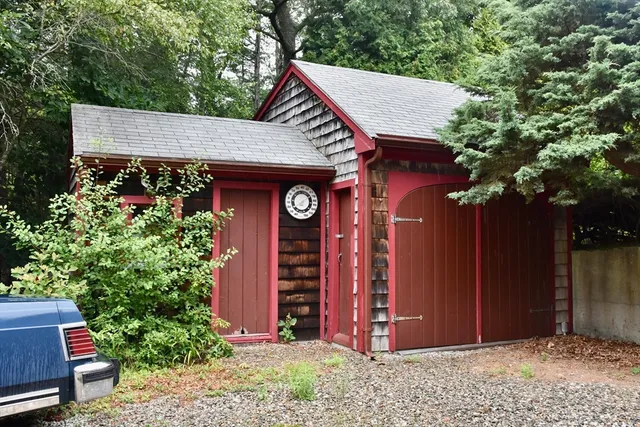 a view of a house with plants and entryway