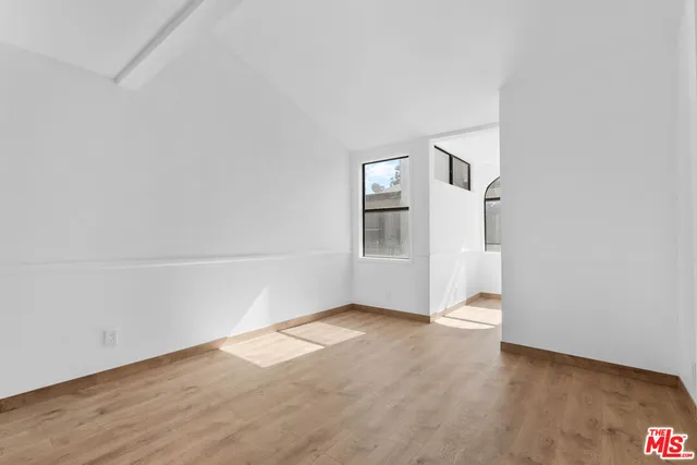 a bathroom with a granite countertop sink a toilet and bathtub