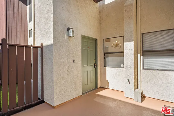 a view of a bathroom with wooden door