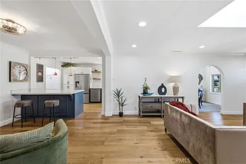 a view of a livingroom with furniture and a flat screen tv