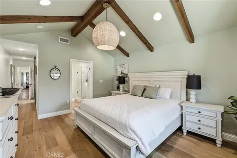 a bedroom with a bed and a walk in closet