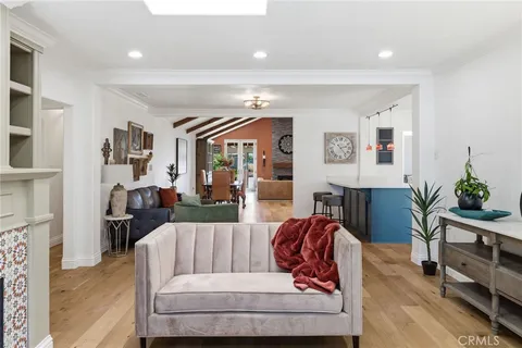 a living room with fireplace furniture and a flat screen tv