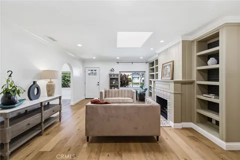 a living room with furniture and flowers