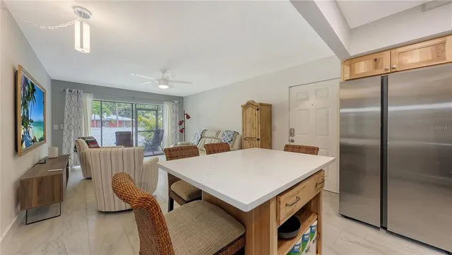 a view of kitchen with furniture and wooden floor
