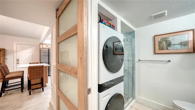 a view of a hallway with washer and dryer